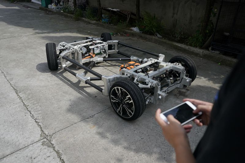 Electric car is seen in a workshop of Automagic in