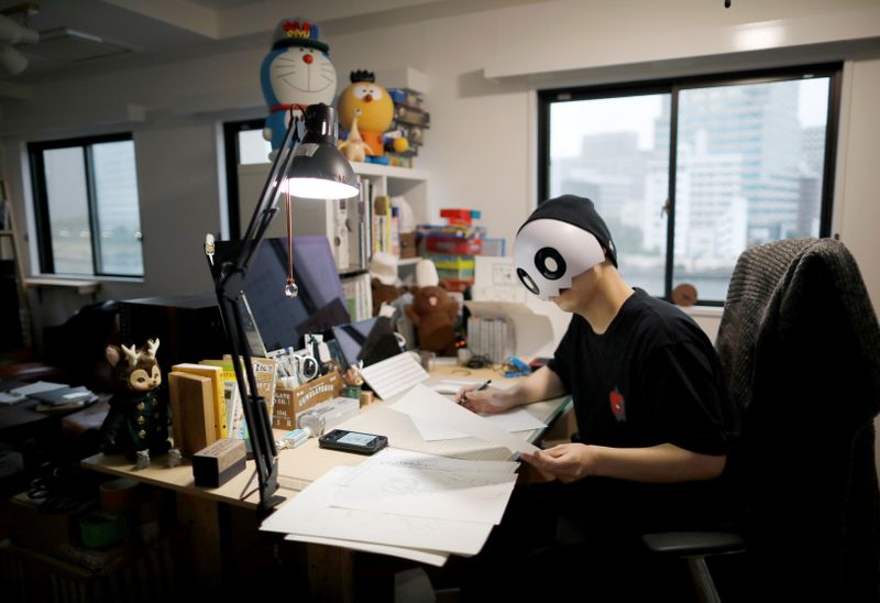 Japanese manga artist Kamentotsu draws his four-panel strip comic ‘Koguma’s