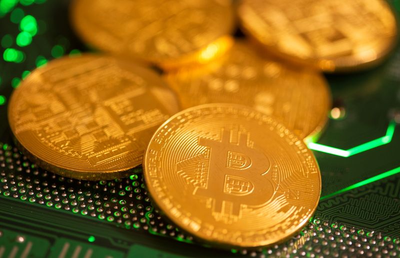 Illustration of representations of virtual currency Bitcoin on a computer