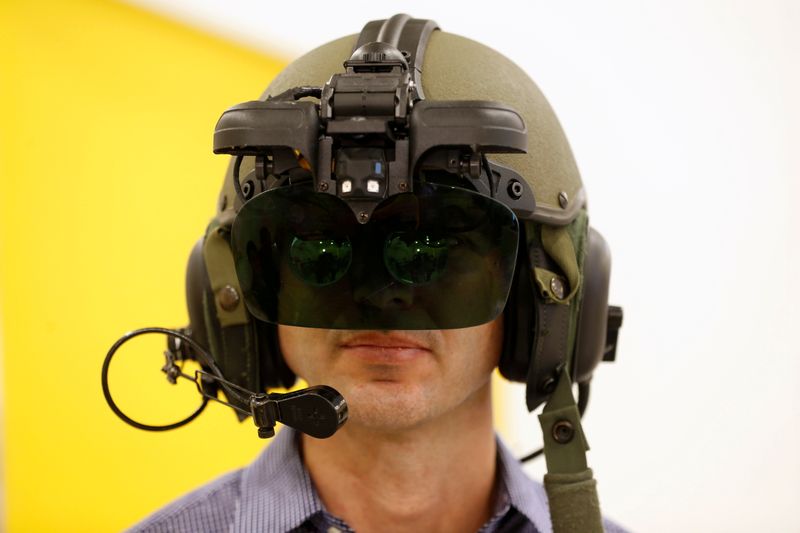 FILE PHOTO: An employee wears IronVision, a 360-degree helmet display