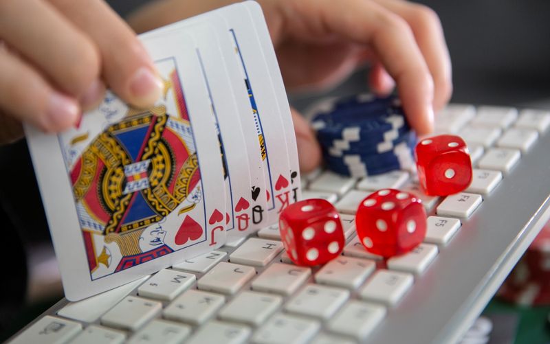 FILE PHOTO: Keyboard, cards, chips, dice are seen in this