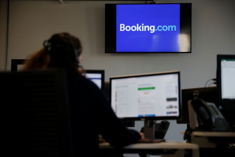 An employee works on his computer at the new Booking.com