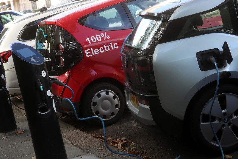 FILE PHOTO: Electric cars are charged at Source power points