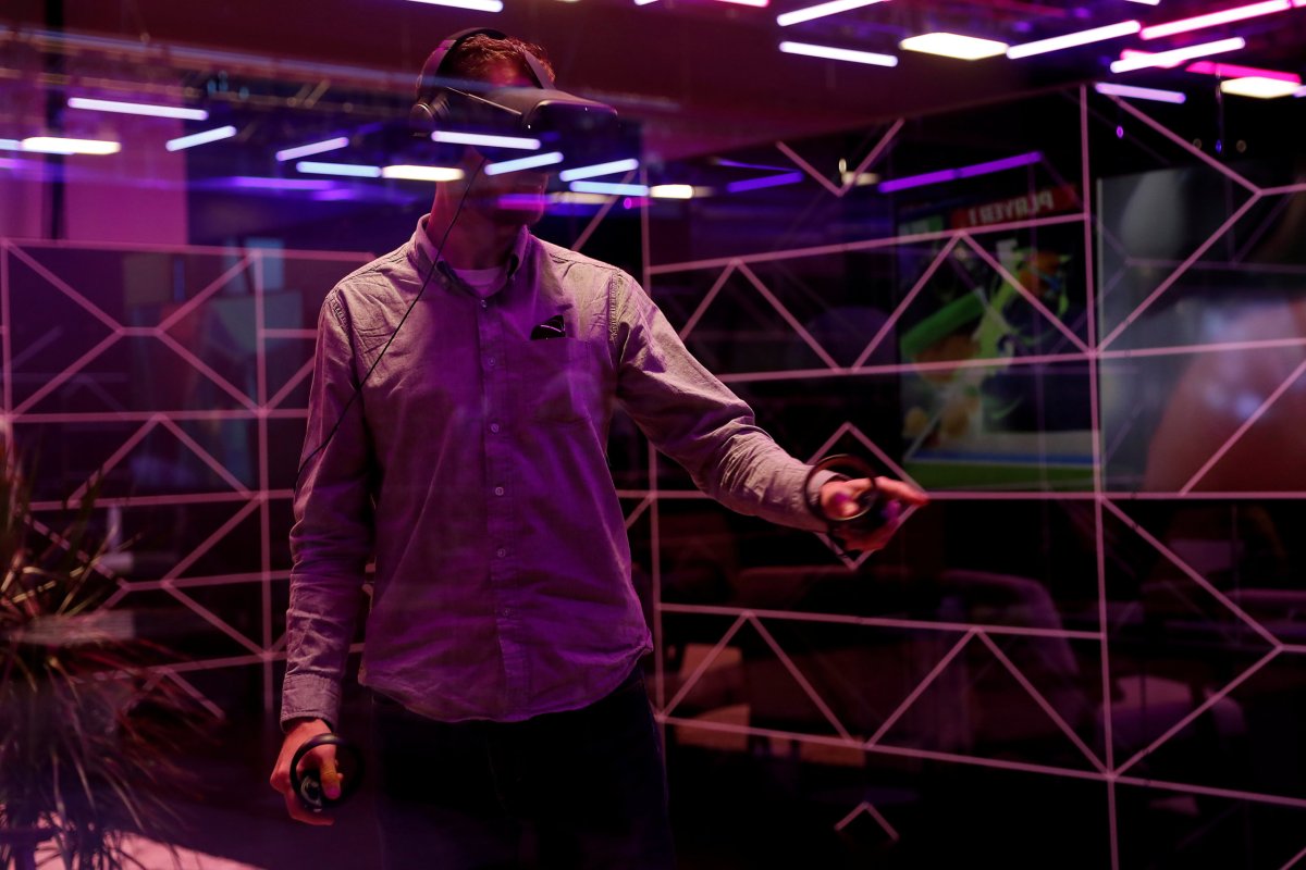 FILE PHOTO: An attendee demos the Oculus Quest wireless virtual