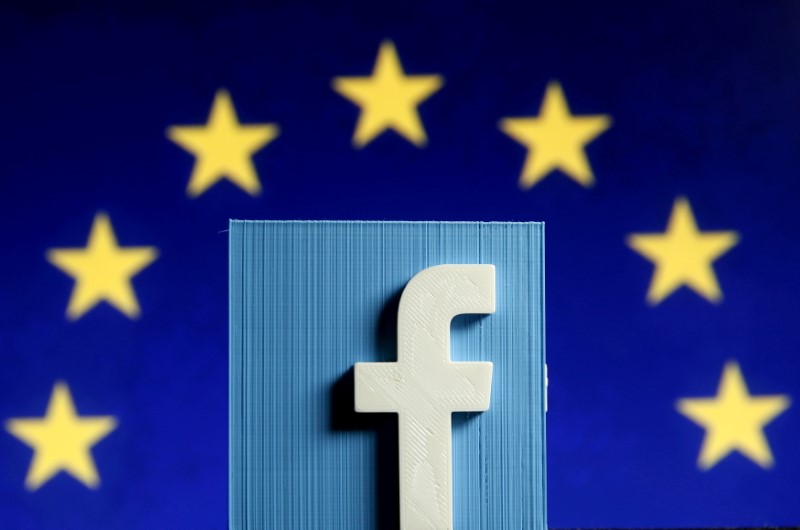 FILE PHOTO: Facebook logo in front of the EU flag