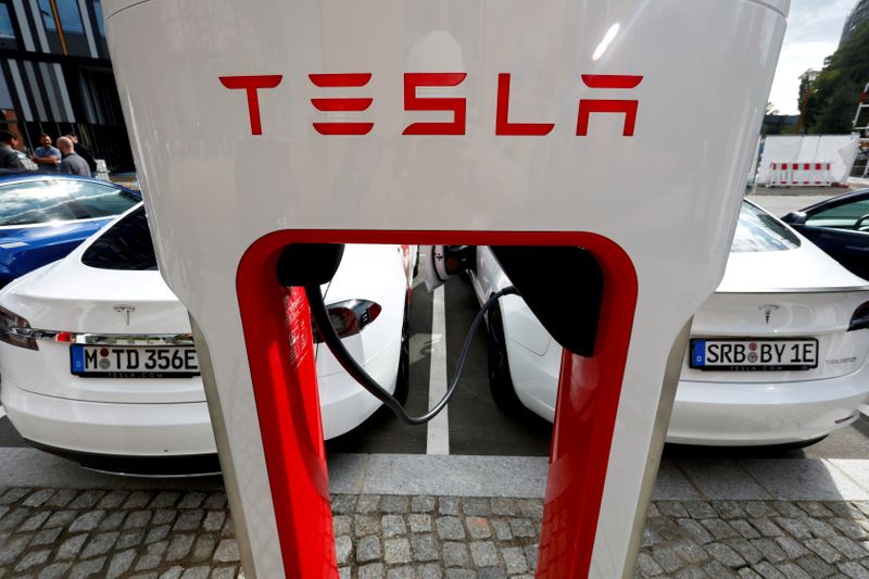 FILE PHOTO: Tesla managers demonstrate V3 superchargers on German research