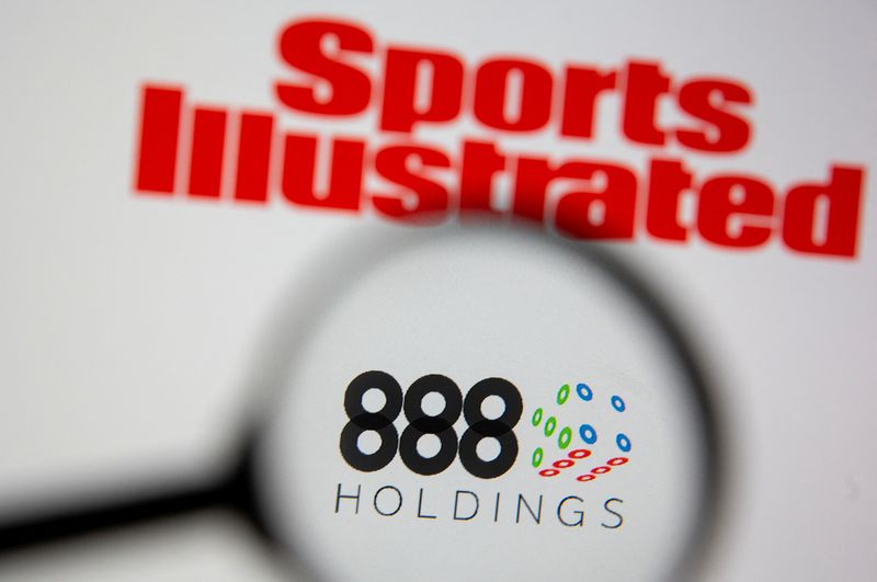 888 Holdings logo are seen through magnifier near Sports Illustrated