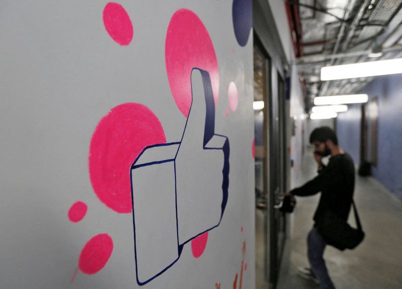 FILE PHOTO: A man enters Facebook’s new office in Mumbai