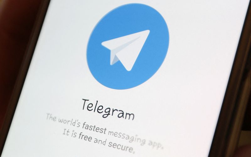 The Telegram logo is seen on a screen of a