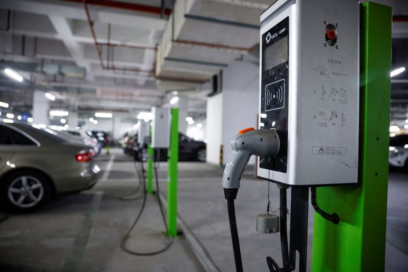 A electric car charging station is pictured in a parking