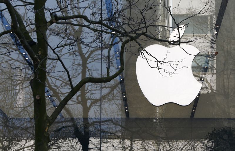 An Apple logo is seen at the entrance of an