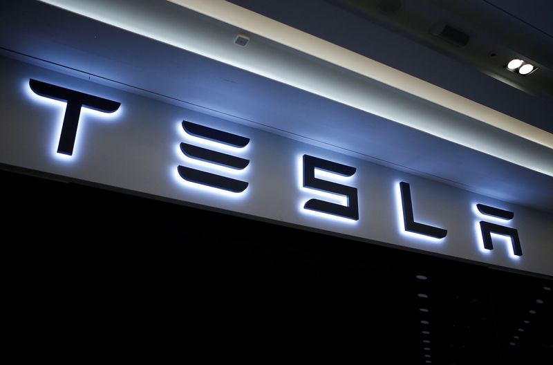 A Tesla logo is seen at its planned store in