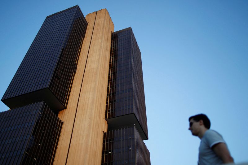 FILE PHOTO: A man stands near the headquarters of the