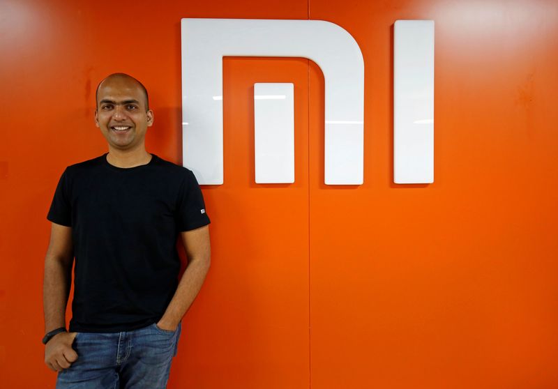 Manu Kumar Jain, Managing Director of Xiaomi India, poses next