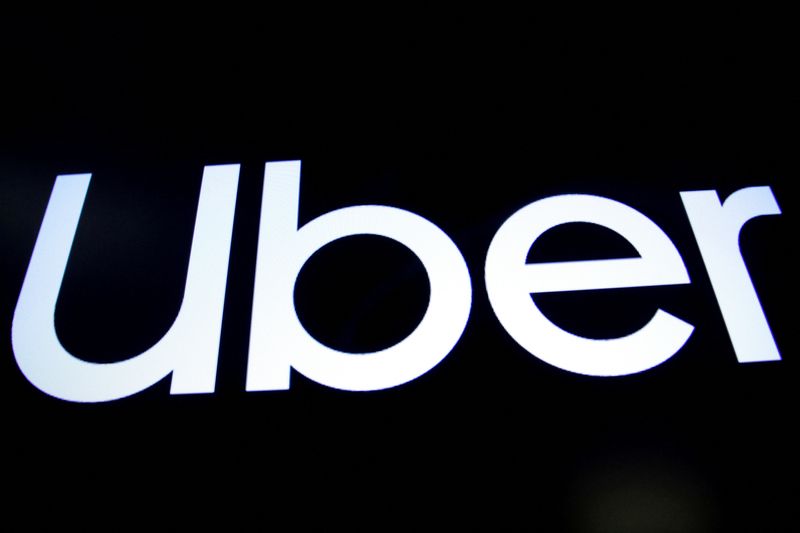 FILE PHOTO: A screen displays the company logo for Uber