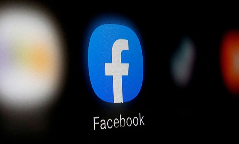 FILE PHOTO: A Facebook logo is displayed on a smartphone