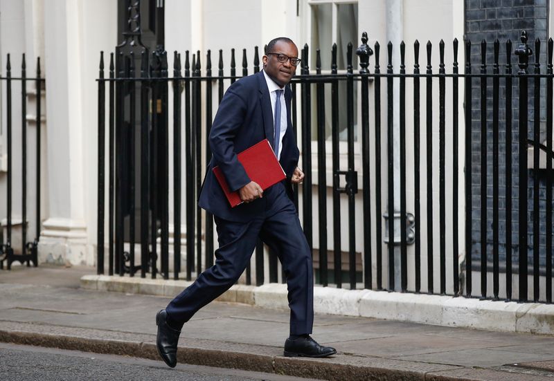British Business and Energy Secretary Kwasi Kwarteng walks outside Downing