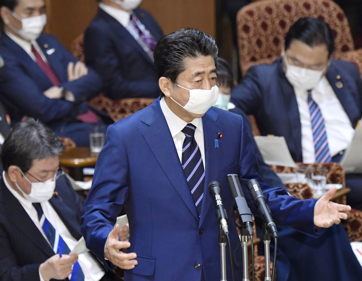 Japan’s Prime Minister Shinzo Abe wearing a protective face mask,