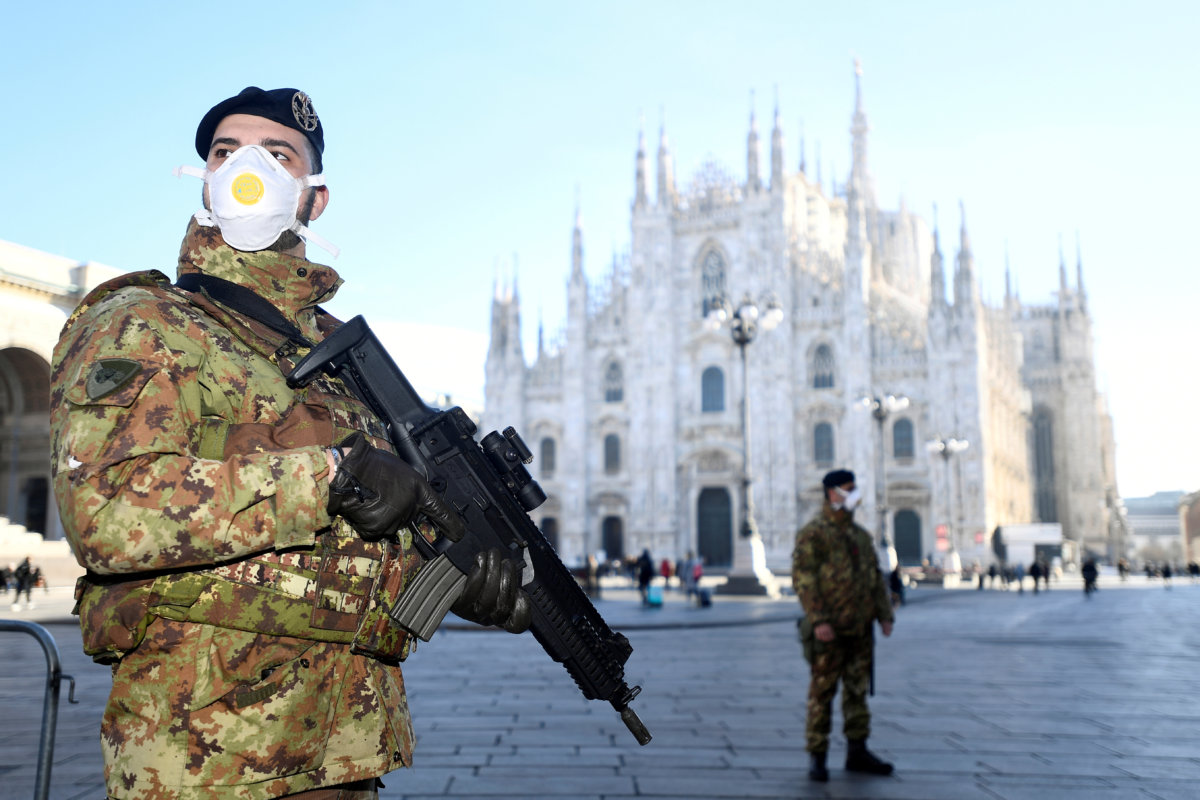 FILE PHOTO: Military officers stand outside Duomo cathedral in Milan