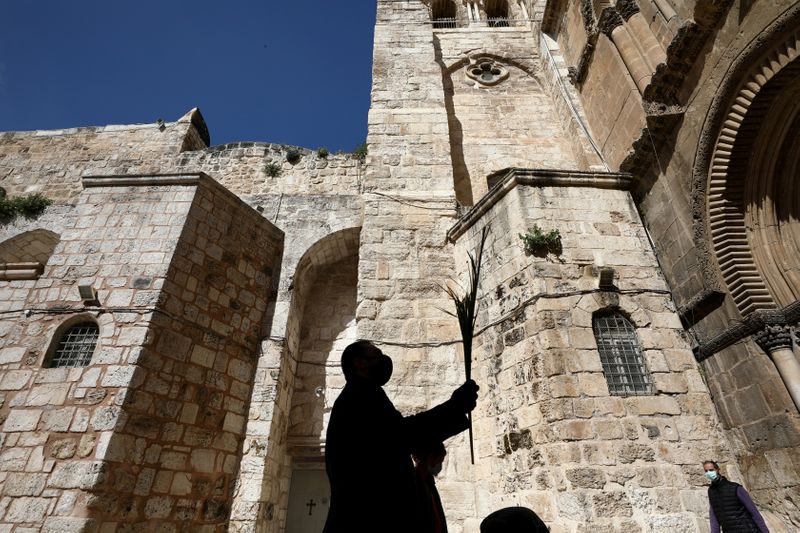 FILE PHOTO: An Orthodox Christian worshipper is silhouetted as he