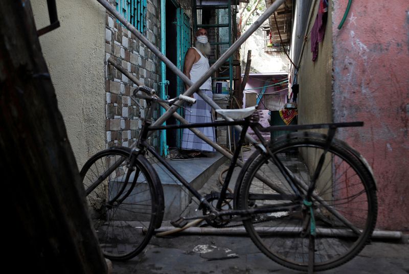 The Wider Image: Indians build their own lockdown barricades in