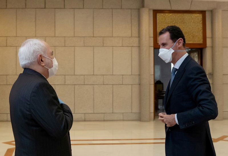 Syria’s President Bashar al-Assad meets with Iran’s Foreign Minister Mohammad