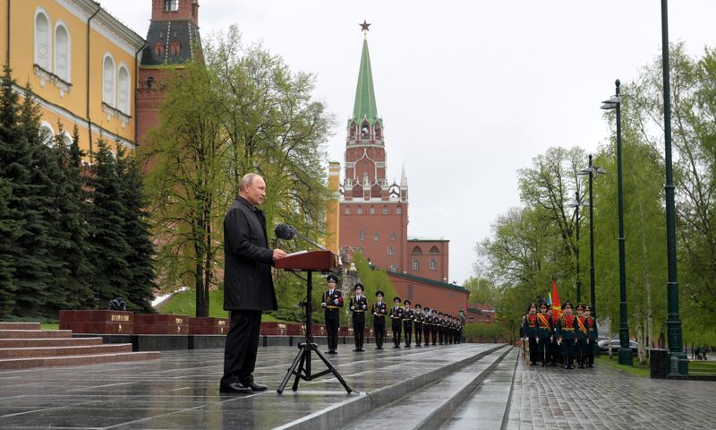 Russian President Vladimir Putin makes an address near the Tomb