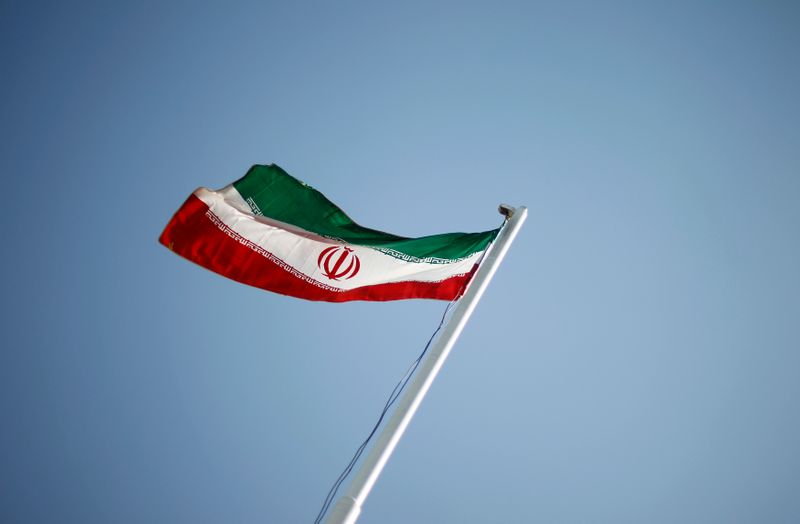 An Iranian national flag flutters during the opening ceremony of