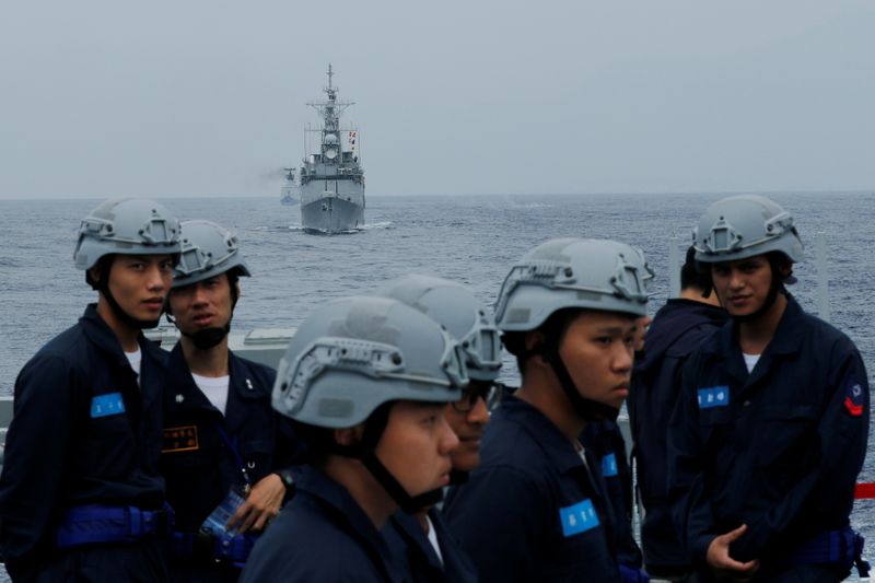 FILE PHOTO: Taiwan Kee Lung (DDG-1801) guided-missile destroyer (C) and