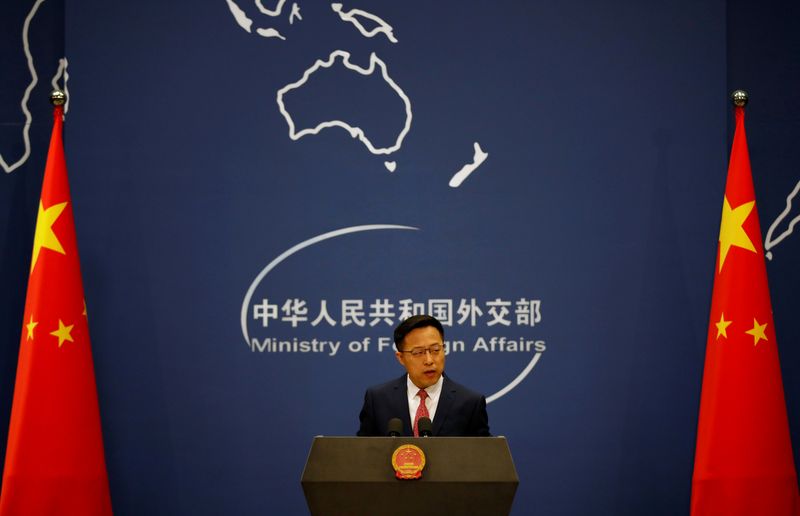 FILE PHOTO: Chinese Foreign Ministry spokesman Zhao Lijian attends a