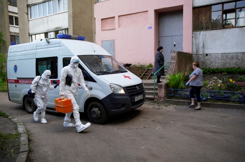 FILE PHOTO: Paramedics carry out their duties amid the coronavirus