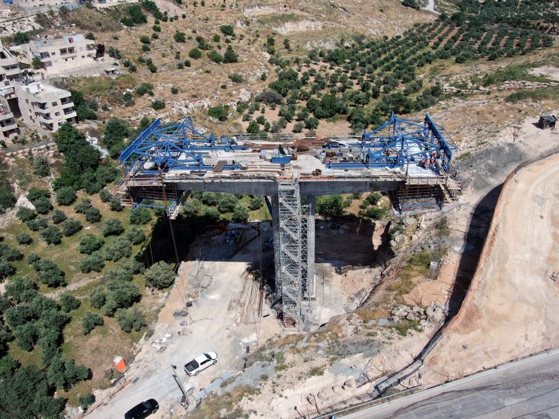 An aerial view shows a bridge under construction as part