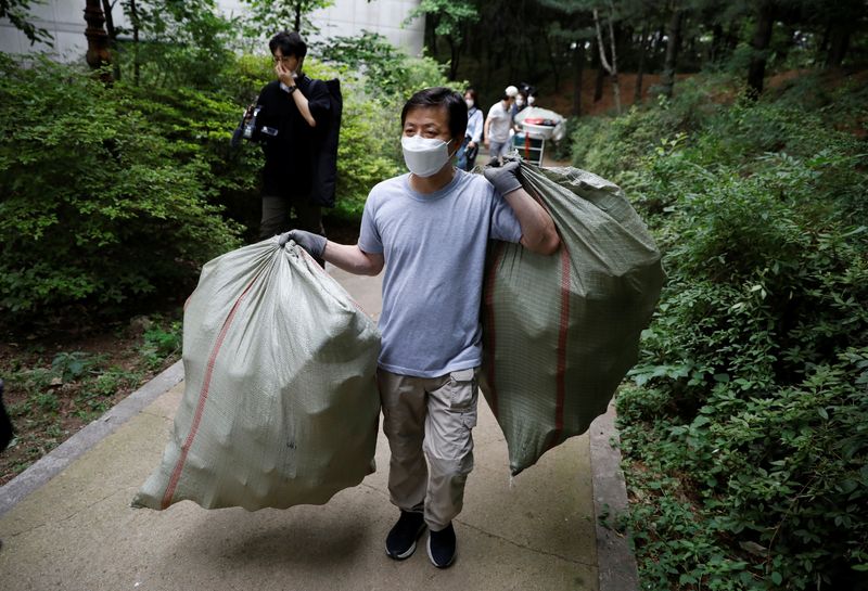 North Korean defector group prepares plastic bottles filled with rice