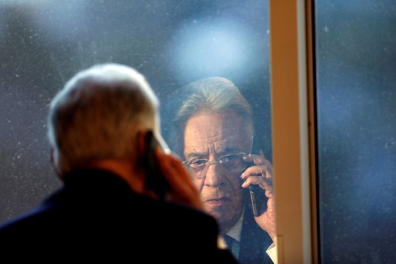 FILE PHOTO: Brazil’s former President Cardoso talks on the phone
