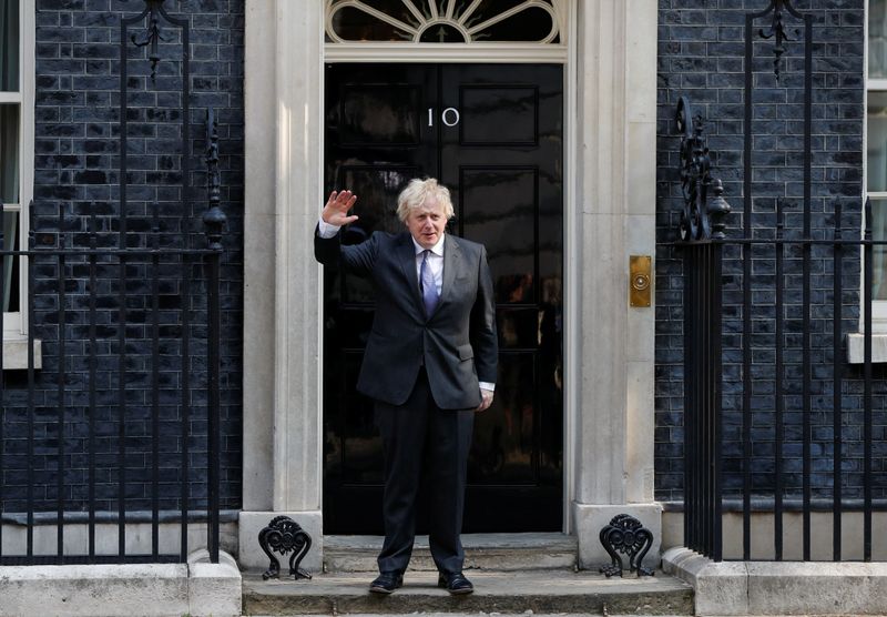 Britain’s Prime Minister Boris Johnson waves as he leaves Downing