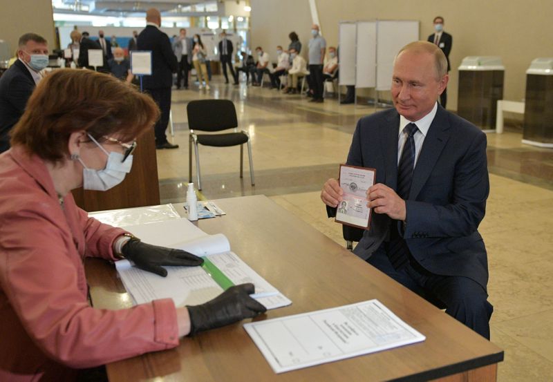 Russian President Putin visits a polling station during a nationwide