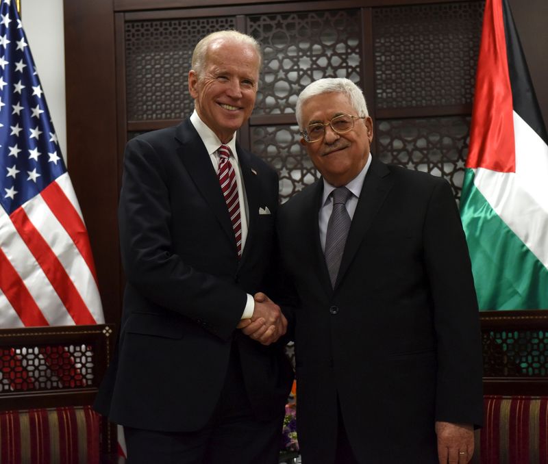 FILE PHOTO: U.S. Vice-President Joe Biden shakes hands with Palestinian