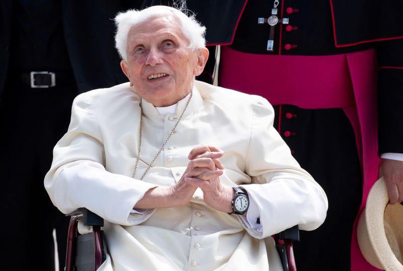 FILE PHOTO: Pope Emeritus Benedict XVI gestures at Munich Airport