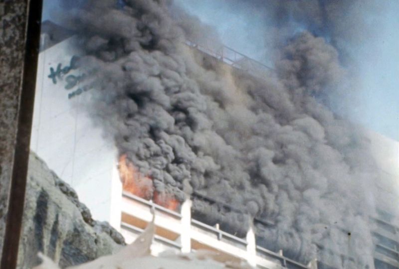 Holiday Inn Hotel is pictured on fire during clashes in