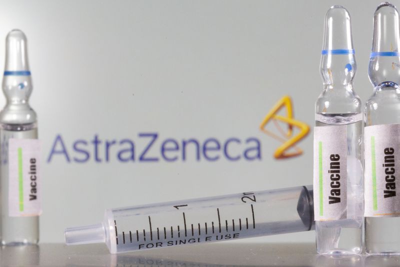 A test tube labelled with the Vaccine is seen in