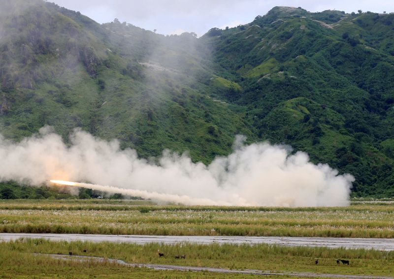FILE PHOTO: U.S. military forces fire a High Mobility Artillery