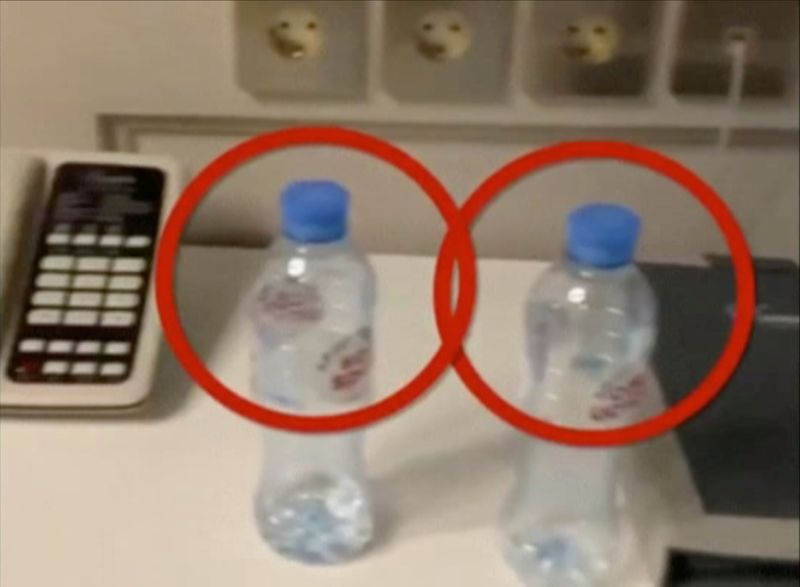Water bottles are seen in a hotel room where Russian