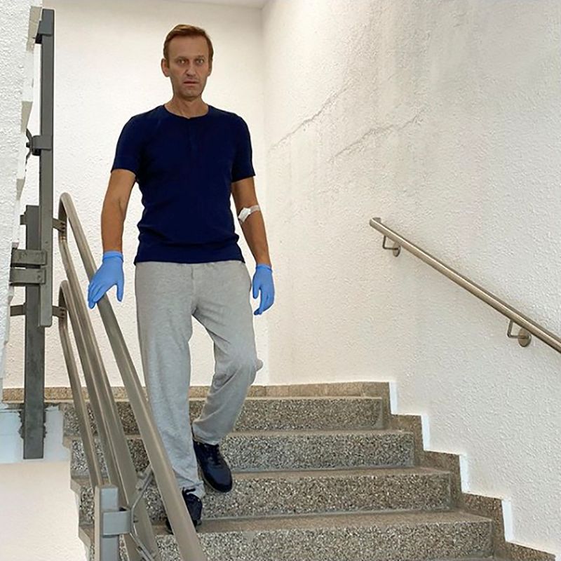 Russian opposition politician Alexei Navalny goes downstairs at Charite hospital