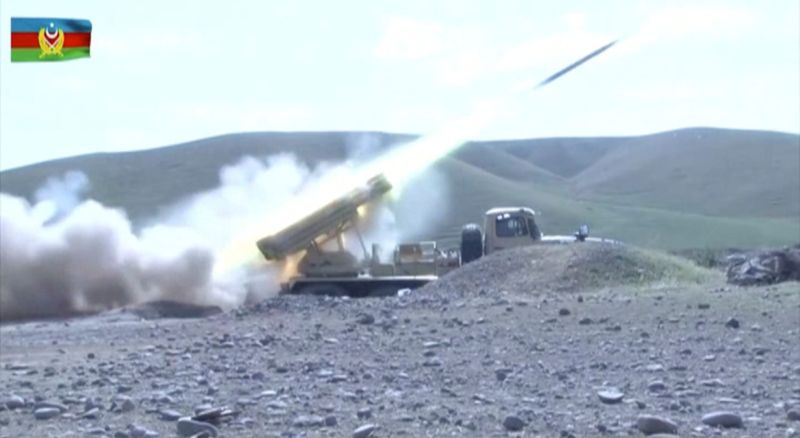A still image shows an Azeri multiple rocket launcher performing