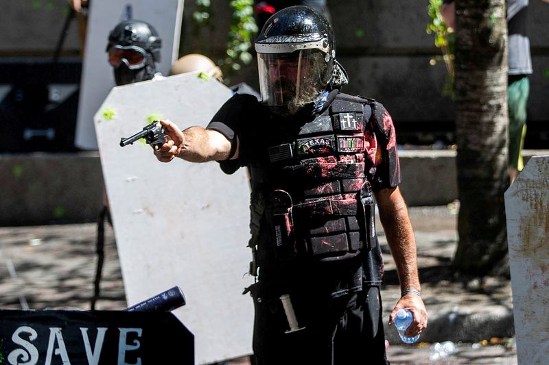 FILE PHOTO: Protesters clash with police in Portland