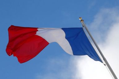 FILE PHOTO: A French flag flutters in the sky over
