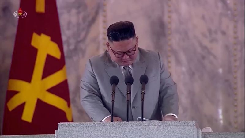 North Korean Leader Kim Jong Un reacts during a speech