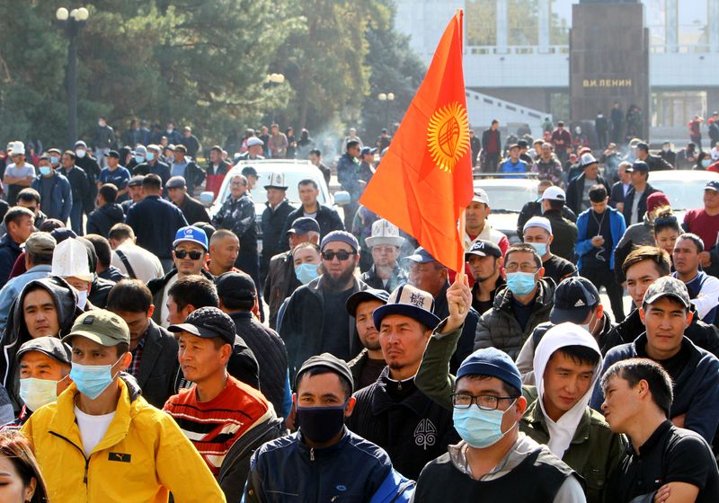People attend a rally to demand the resignation of Kyrgyzstan’s