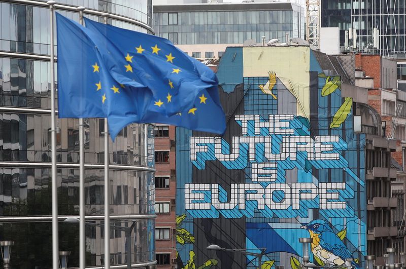 European Union’s flags flutter outside the European Commission headquarters in