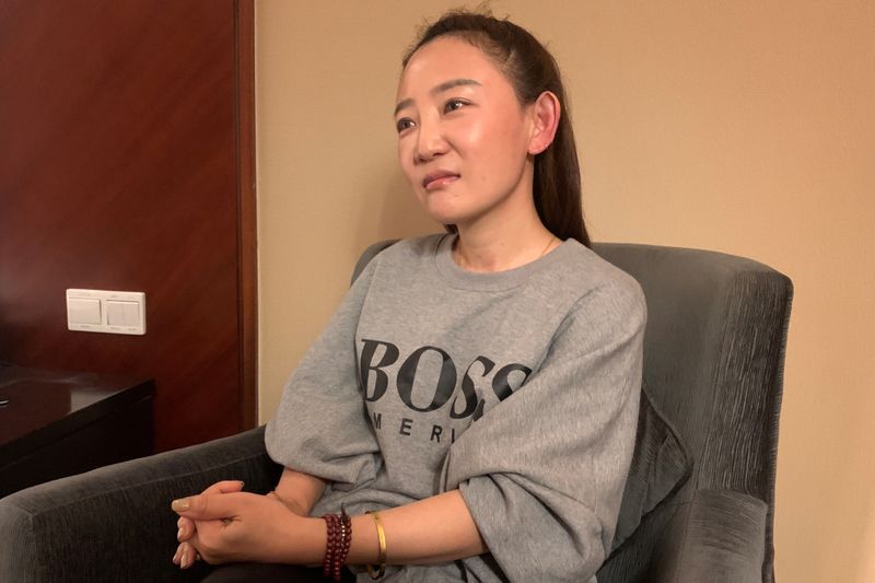 Yuan Xiaoliang, wife of Australian writer Yang Hengjun, talks to